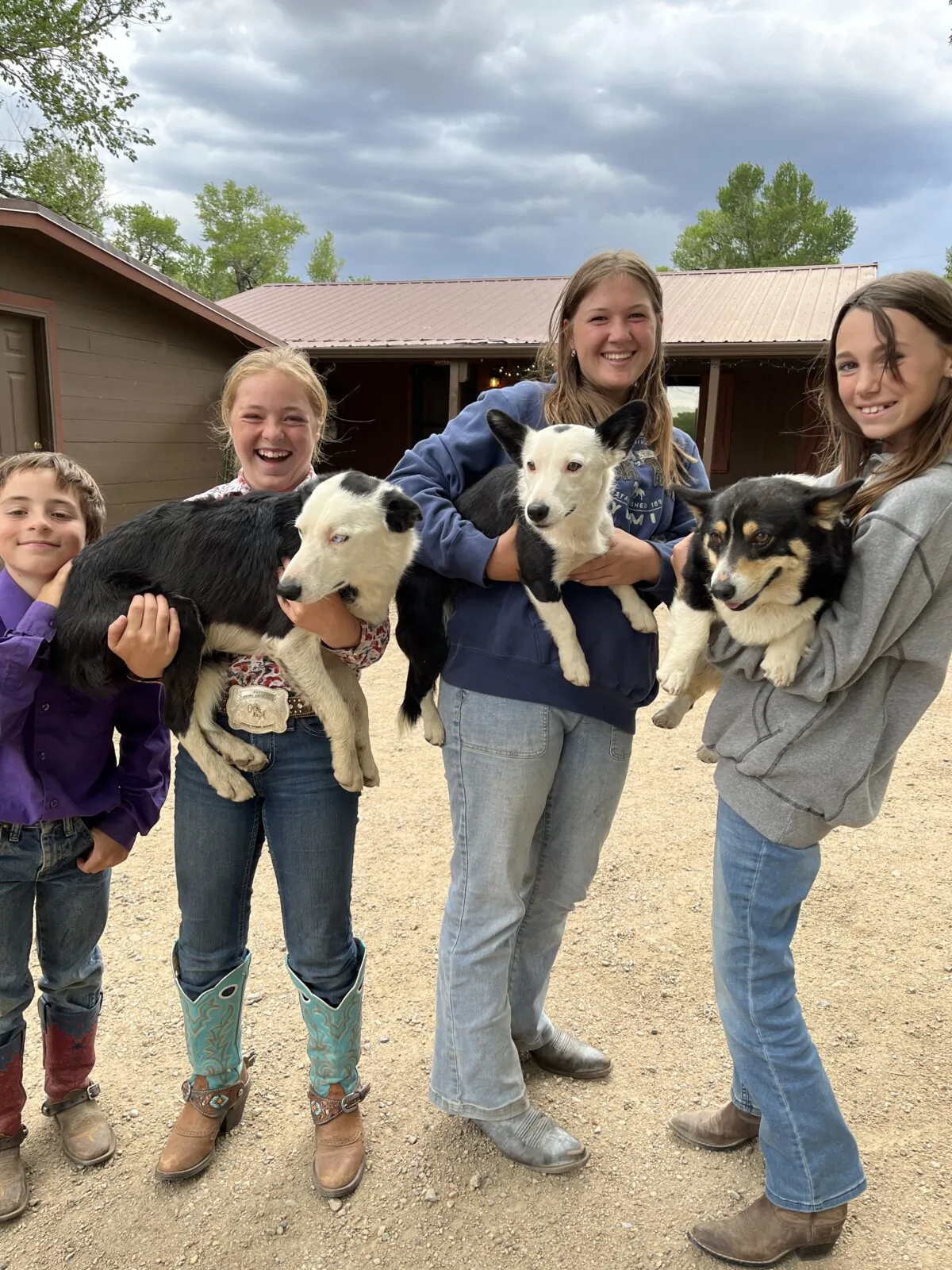 Kids and ranch dogs at Vee Bar Ranch. (Andy Yemma/TNS)