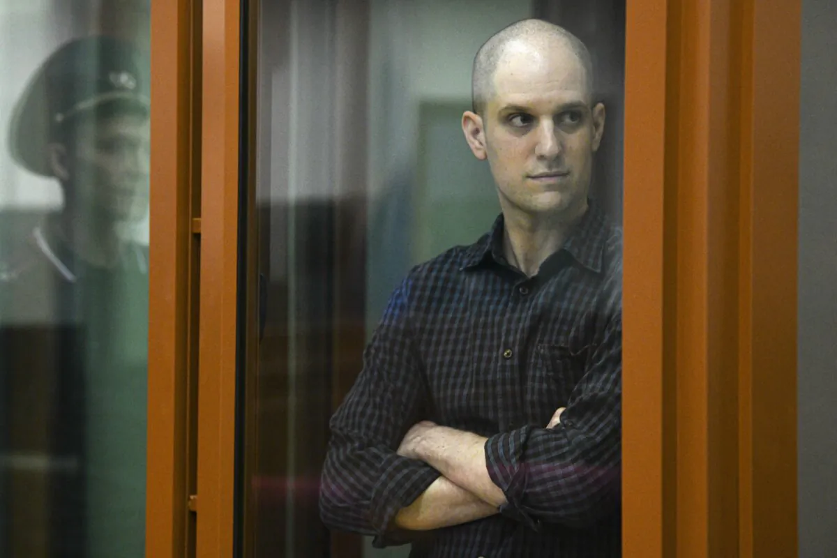 Wall Street Journal reporter Evan Gershkovich stands in a courtroom in Yekaterinburg, Russia, on June 26, 2024. (AP Photo)