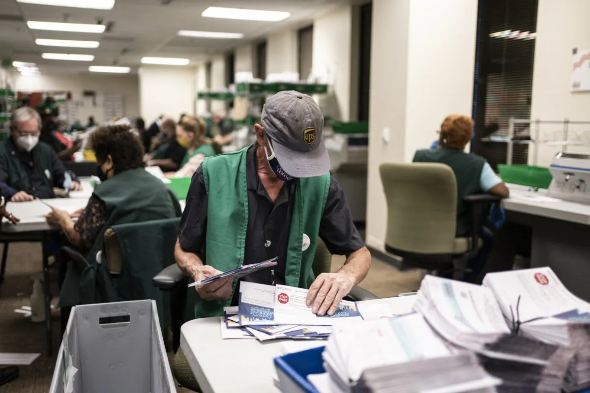 Election judges verify and count ballots at the Denver Elections Division in Denver, Colo., on Nov. 3, 2020. (Chet Strange/AFP via Getty Images)