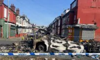 Leeds Rioters Overturn Police Car and Set Vehicles on Fire