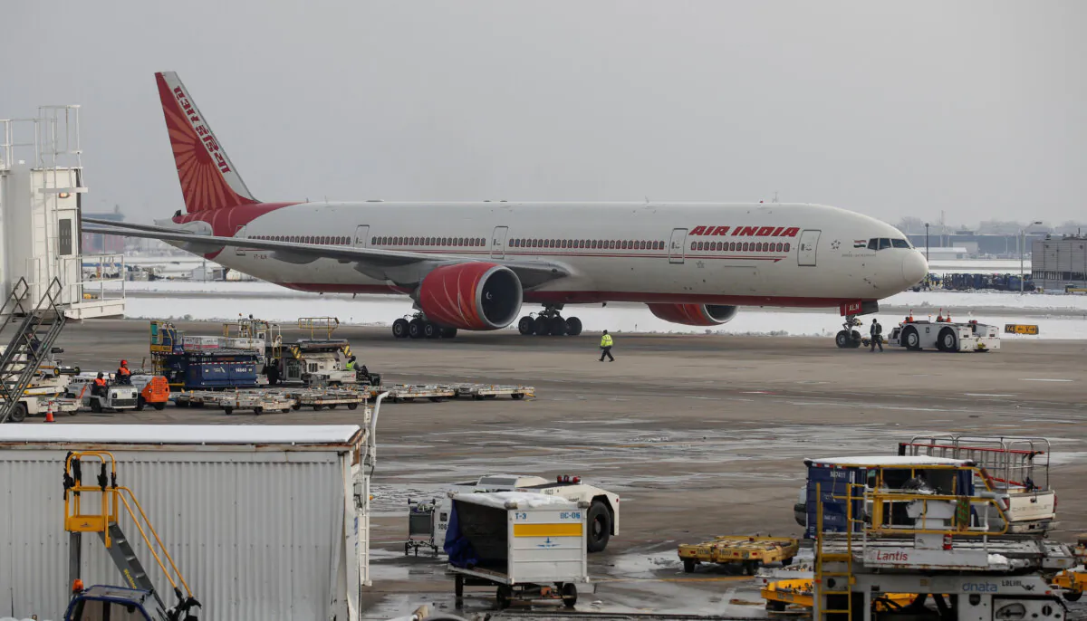 An Air India Boeing 777-300ER plane is towed at O'Hare International Airport in Chicago, Ill., on Nov. 30, 2018. (Kamil Krzaczynski/Reuters)