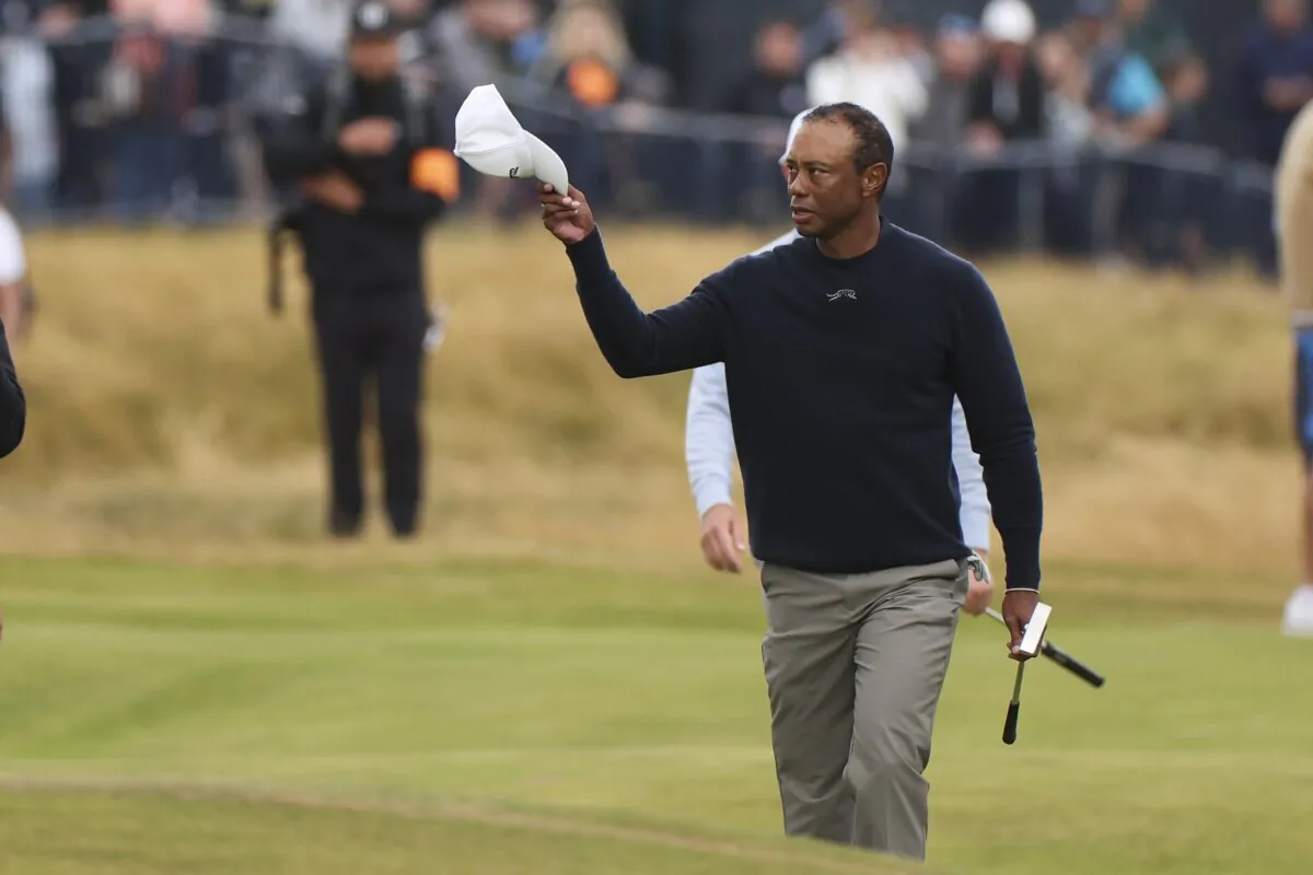 Tiger Woods of the United States waves as he walks to the 18th green during his second round of the British Open Golf Championships at Royal Troon golf club in Troon, Scotland, on July 19, 2024. (Scott Heppell/AP Photo)