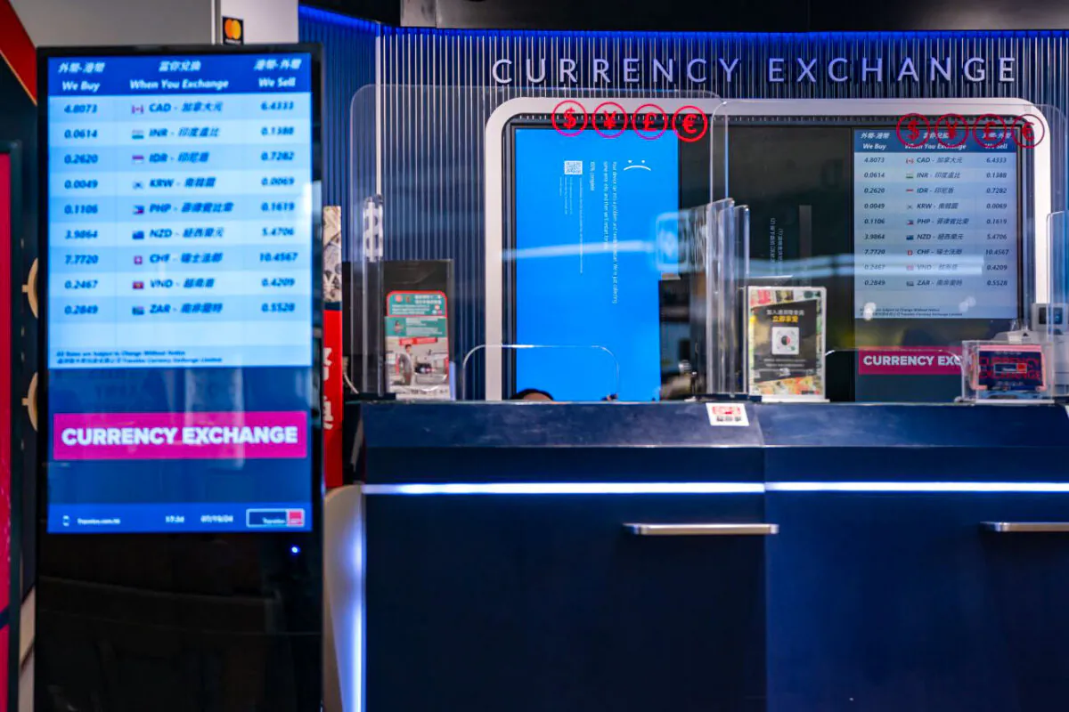 A error blue screen is displayed at a currency exchange store at the Hong Kong International Airport on July 19, 2024 in Hong Kong. (Anthony Kwan/Getty Images)