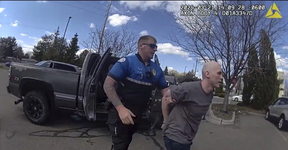 Skylar Meade (R) is arrested in Twin Falls on March 21, 2024, in a still from body camera footage. (Twin Falls Police Department via AP)