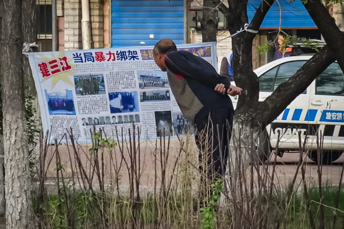A poster with information by practitioners of Falun Gong clarifying the facts about their spiritual practice in the face of slanderous propaganda from the state is displayed in public in Jiamusi, Heilongjiang Province, China, on Jan. 6, 2018. (Falun Dafa Information Center)
