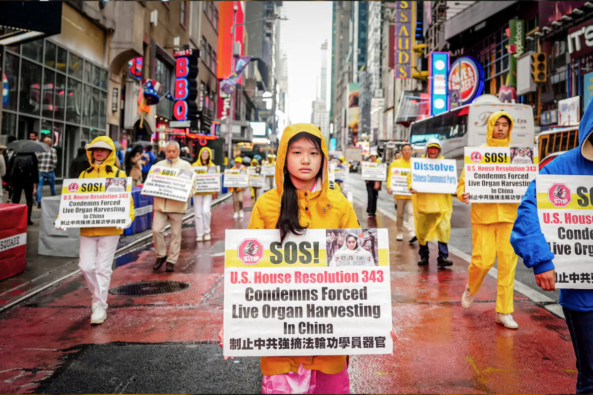 Falun Gong practitioners take part in a parade to celebrate World Falun Dafa Day, while calling for an end to the persecution against Falun Gong in China, in New York City on May 10, 2024. (Samira Bouaou/The Epoch Times)