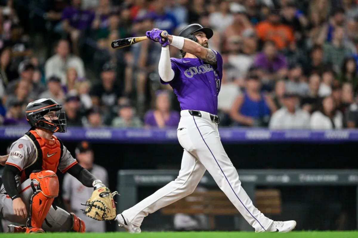 Jake Cave (11) of the Colorado Rockies hits an eighth inning three-run home run against the San Francisco Giants in Denver on July 19, 2024. (Dustin Bradford/Getty Images)