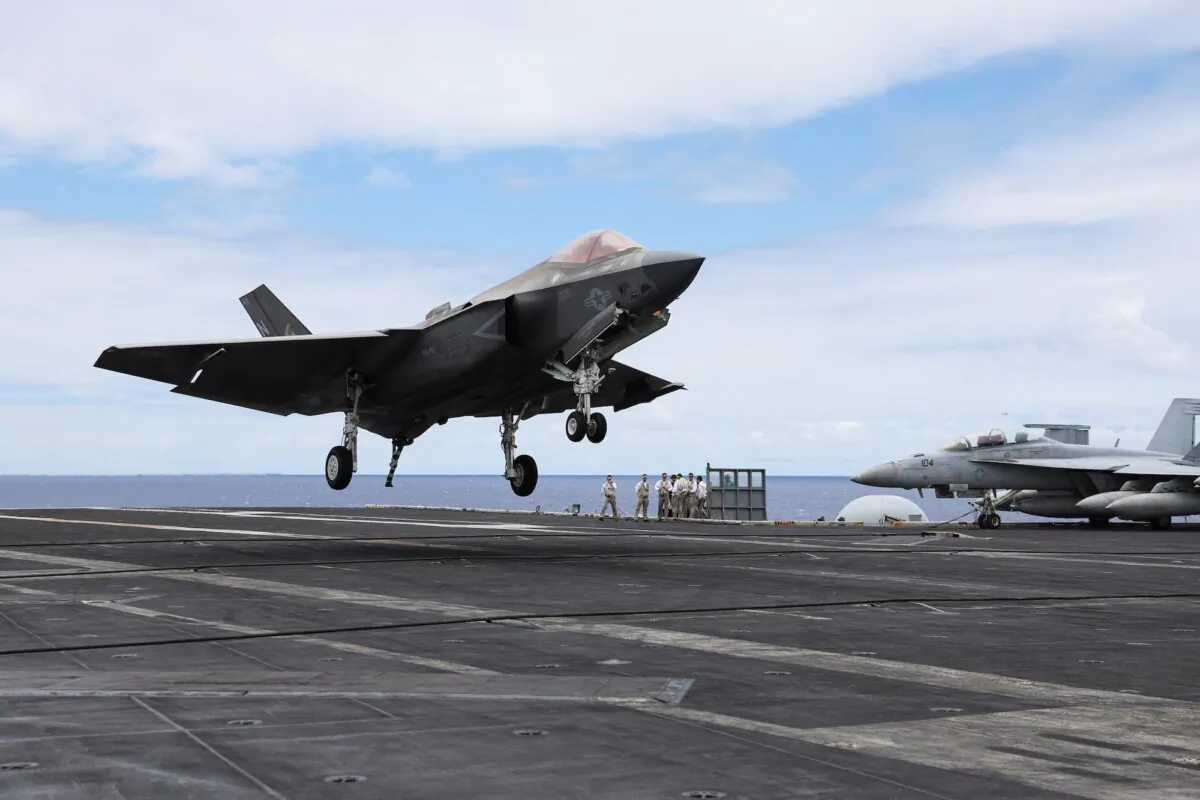 A F-35 jet lands on the runway of the USS Carl Vinson aircraft carrier during the Rim of the Pacific (RIMPAC) military exercises, about 100 miles south of Oahu, Hawaii, on July 19, 2024. (Marco Garcia/File Photo/Reuters)