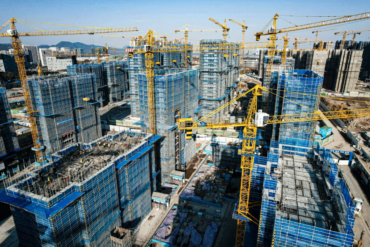The aerial view shows residential buildings under construction by Chinese real estate developer Vanke in Hangzhou, in eastern China's Zhejiang Province, on March 15, 2024. (STR/AFP via Getty Images)