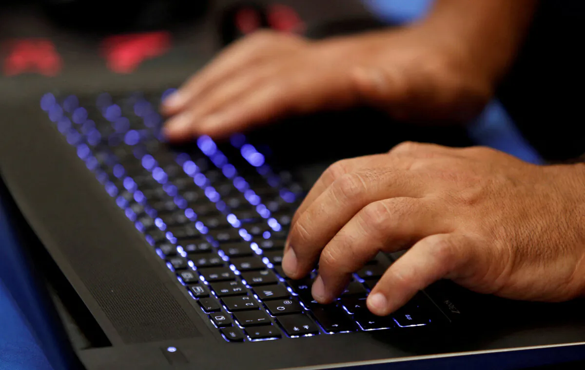 A man types into a keyboard during the Def Con hacker convention in Las Vegas on July 29, 2017. (Steve Marcus/Reuters)