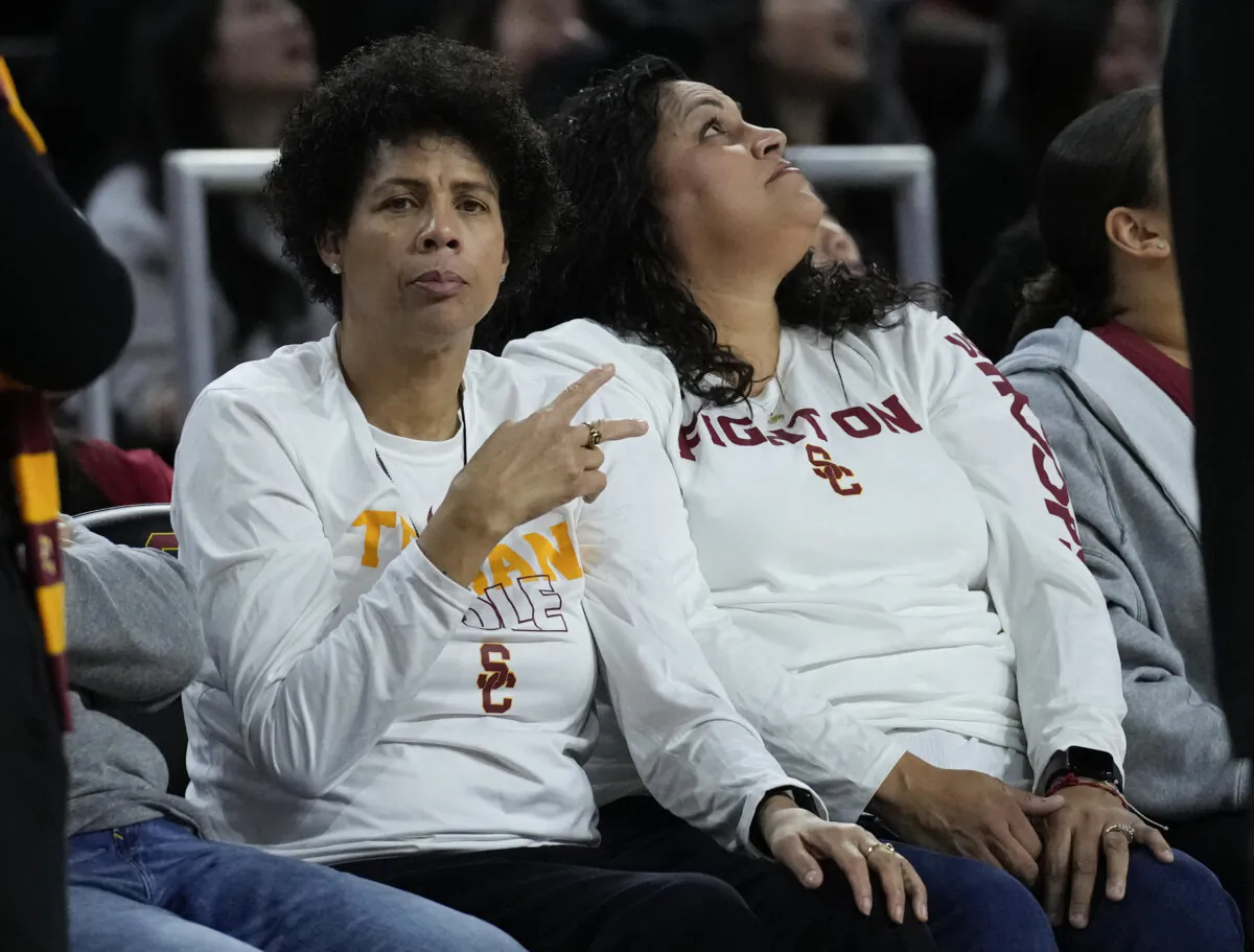 Basketball Hall of Famer Cheryl Miller (L) greets fans during the first half of an NCAA college basketball game against UCLA in Los Angeles on, Jan. 14, 2024. (Ashley Landis/AP Photo)