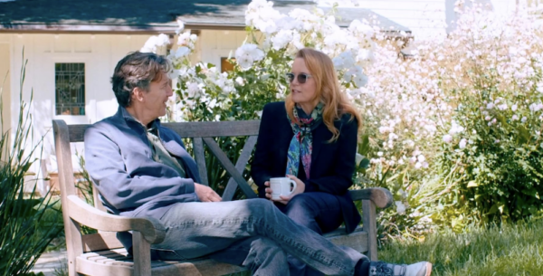 man and woman sit on bench in "Brats."