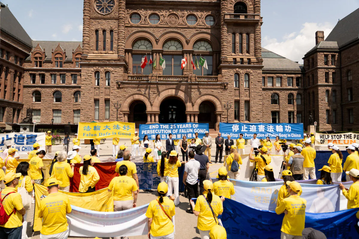 Falun Gong adherents and supporters attend a rally at Queen's Park in Toronto, Ont., on July 20, 2024. The event commemorates the 25th anniversary of the Chinese regime's persecution of Falun Gong. (Evan Ning/ The Epoch Times)