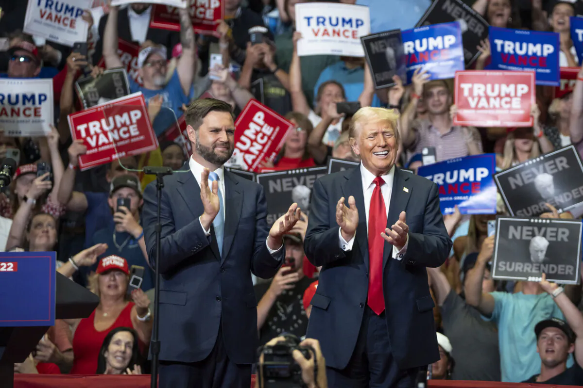 Republican Vice President nominee Sen. JD Vance (R-Ohio) (L) and former President Donald Trump (R) at a rally at the Van Andel Arena in Grand Rapids, Mich., on July 20, 2024. (Madalina Vasiliu/The Epoch Times)