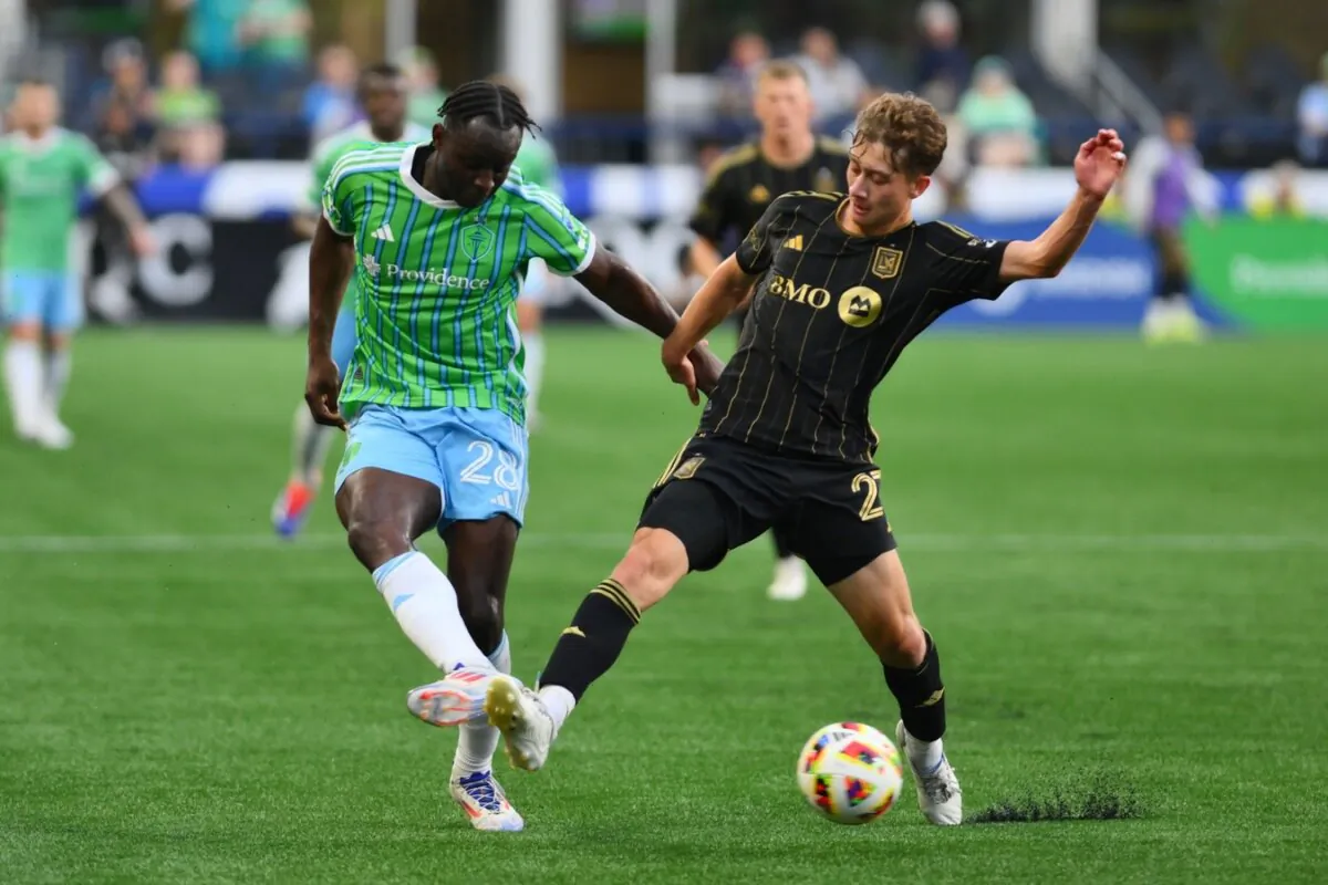 Seattle Sounders FC defender Yeimar (28) and LAFC forward Nathan Ordaz (27) battle for the ball in the first half of an MLS soccer match in Seattle on July 20, 2024. (Steven Bisig/USA TODAY Sports via Field Level Media)