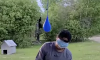 People Get Wet in Water Balloon Game While Sitting on Chair Blindfolded