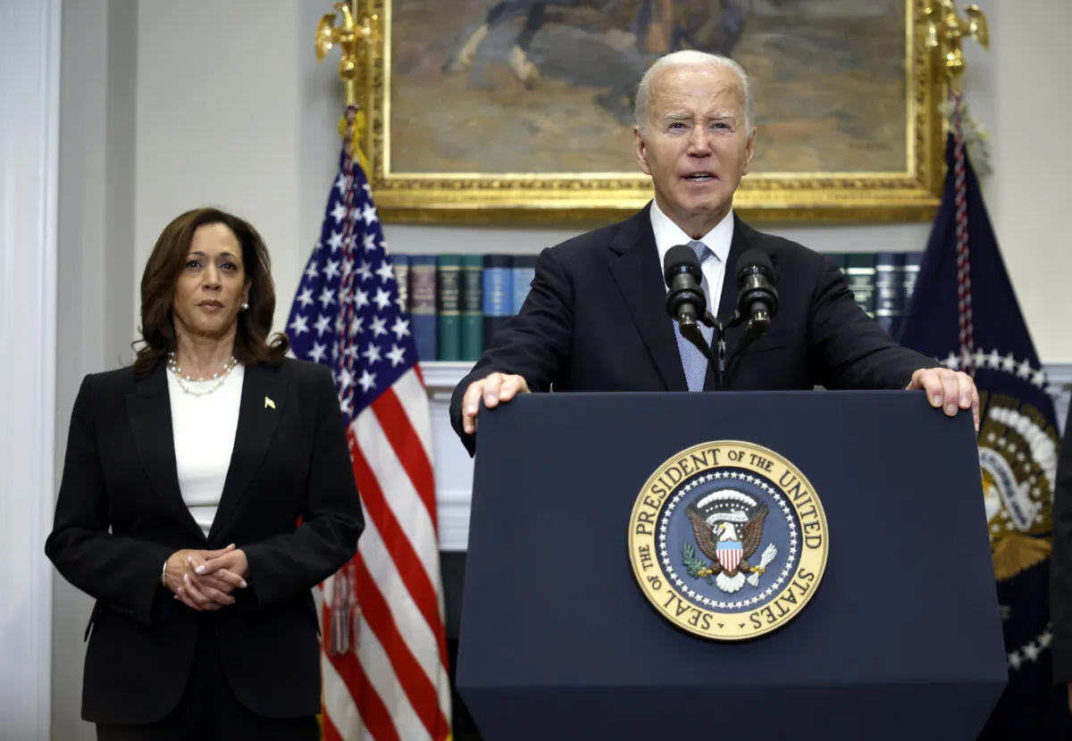 President Joe Biden delivers remarks as Vice President Kamala Harris looks on, at the White House on July 14, 2024. (Kevin Dietsch/Getty Images)