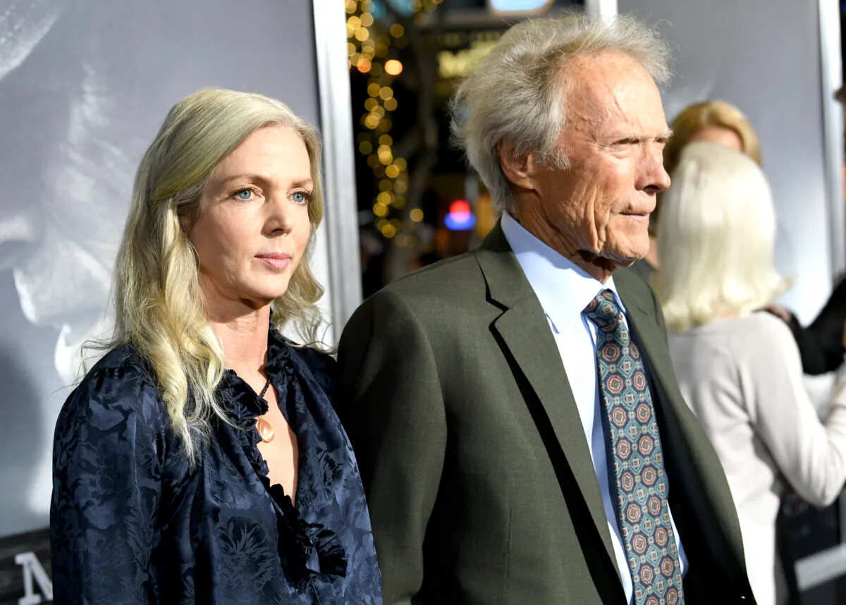 Christina Sandera (L) and Clint Eastwood arrive at the premiere of Warner Bros. Pictures' "The Mule" at the Village Theatre in Los Angeles on Dec. 10, 2018. (Kevin Winter/Getty Images)