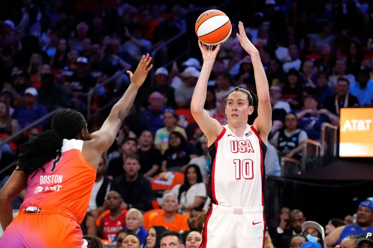 Breanna Stewart of the U.S. Olympic women's basketball team shoots over Team WNBA's Aliyah Boston during the WNBA All-Star Game in Phoenix on July 20, 2024. (Ross D. Franklin/AP Photo)