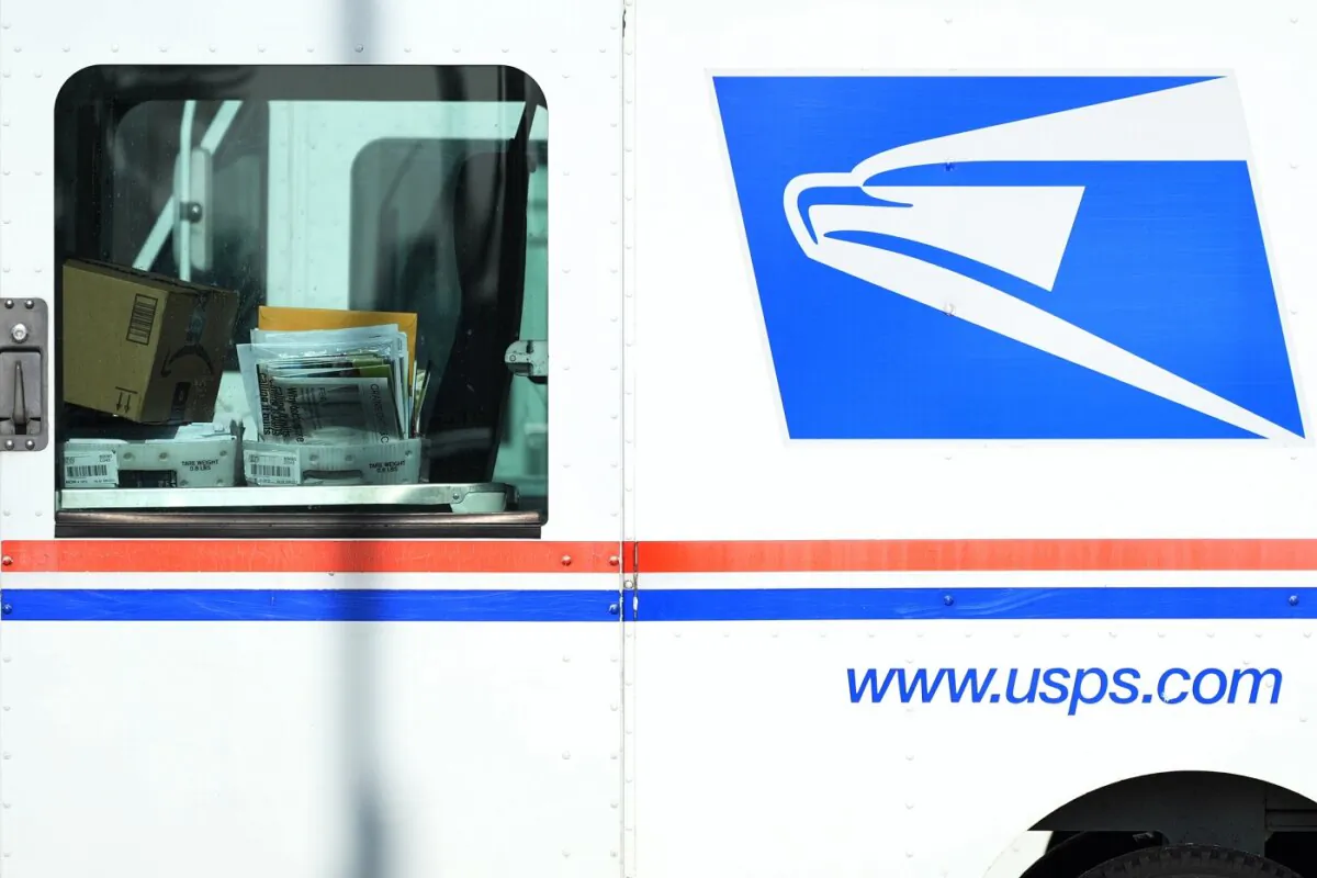 Letters and packages are loaded on a U.S. Postal Service truck parked outside a post office in Wheeling, Ill., on Jan. 29, 2024. (Nam Y. Huh/AP Photo)