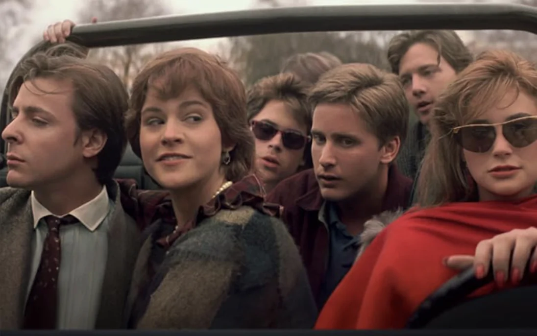 (L–R) Judd Nelson, Ally Sheedy, Rob Lowe, Emilio Estevez, Andrew McCarthy, and Demi Moore make up most of the Brat Pack, in "Brats." (Neon/Hulu)