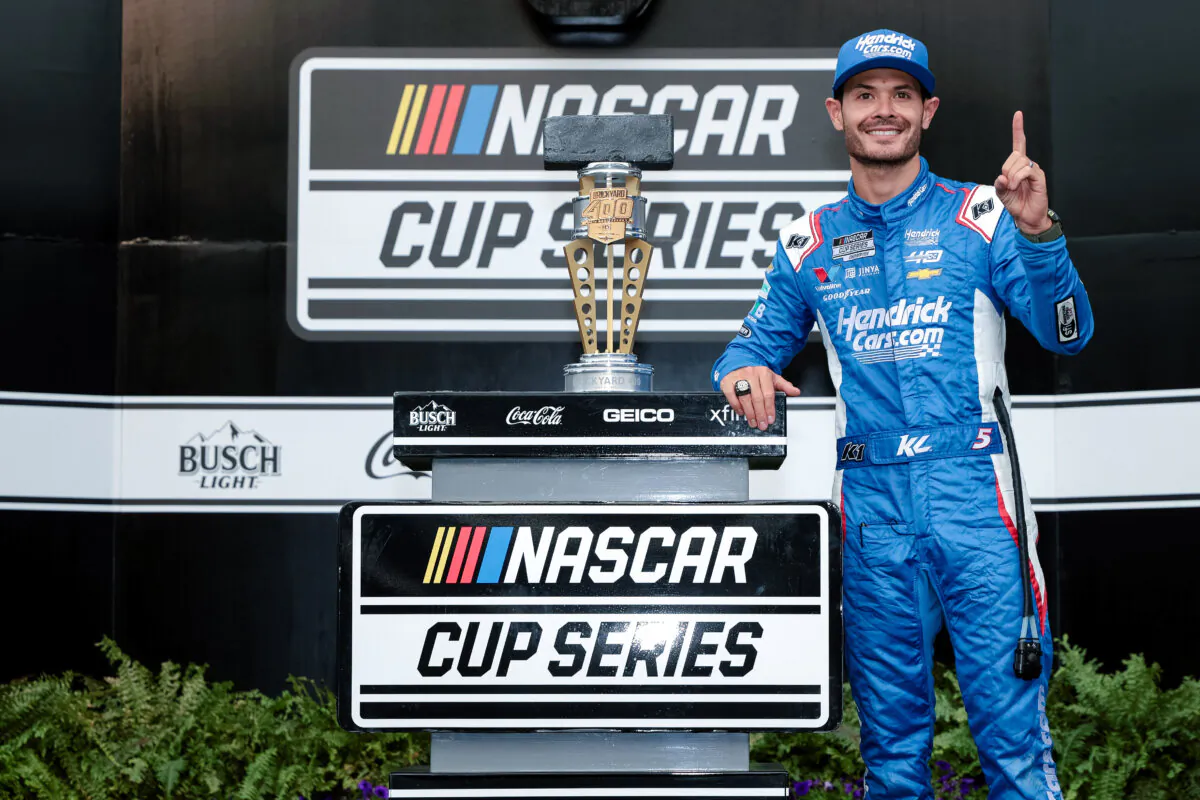 Kyle Larson celebrates in victory lane after winning the NASCAR Cup Series Brickyard 400 at Indianapolis Motor Speedway in Indianapolis, Ind., on July 21, 2024. (James Gilbert/Getty Images)