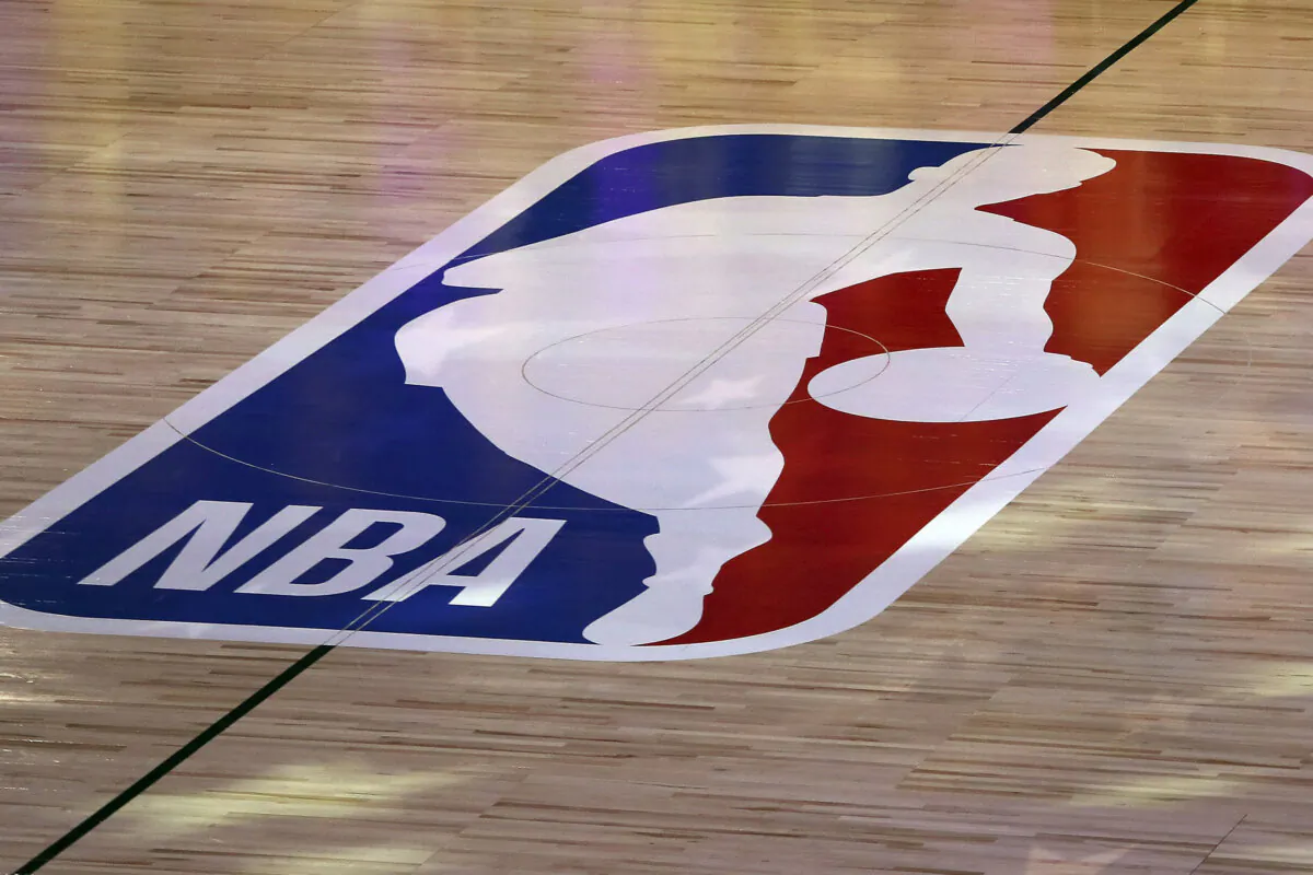 An NBA logo is seen at center court prior to a game between the Los Angeles Clippers and Los Angeles Lakers in Lake Buena Vista, Fla., on July 30, 2020. (Mike Ehrmann/Getty Images via AP)