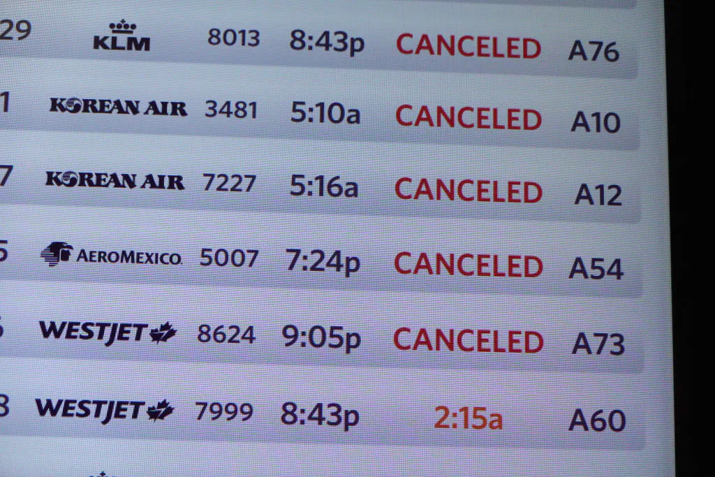 A departure board shows canceled flights in the McNamara terminal at the Detroit Metropolitan Wayne County Airport on July 20, 2024. (Joe Raedle/Getty Images)