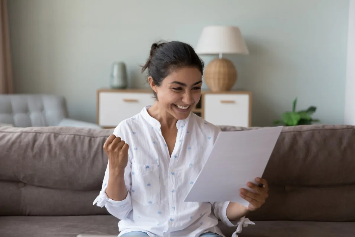 Give yourself a pat on the back after when you successfully get out of debt. (fizkes/Shutterstock)