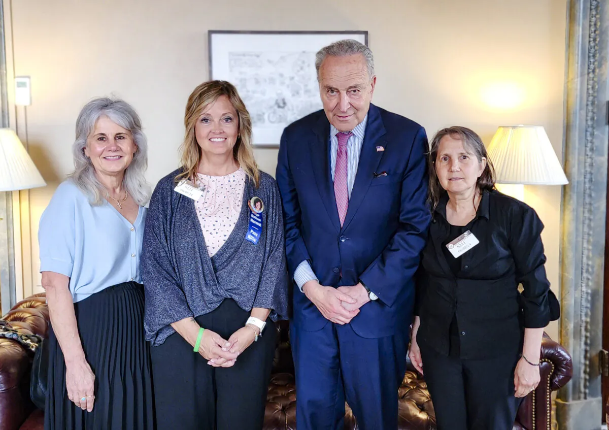 Maurine Molak (L), Joann Bogard (2nd L), Deb Schmill (R), and Senate Majority Leader Chuck Schumer (D-N.Y.) in Washington on June 5, 2024. (Courtesy of Joann Bogard)