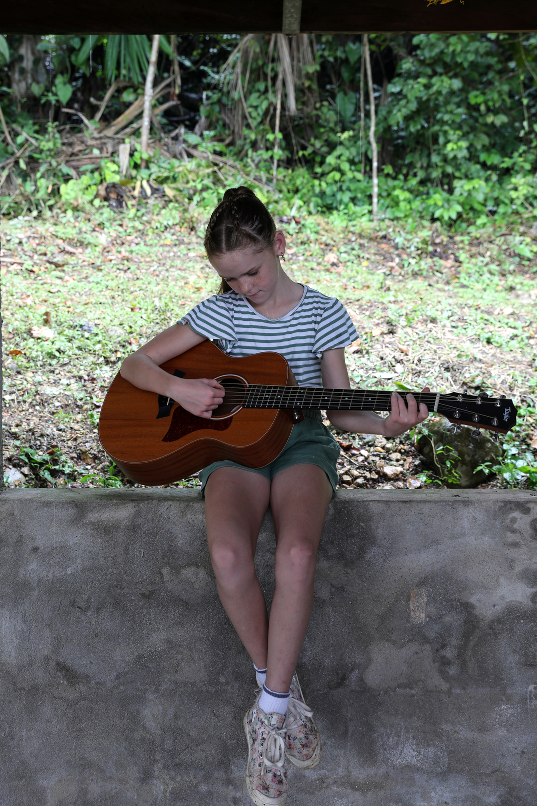 Cambridge practising the guitar.