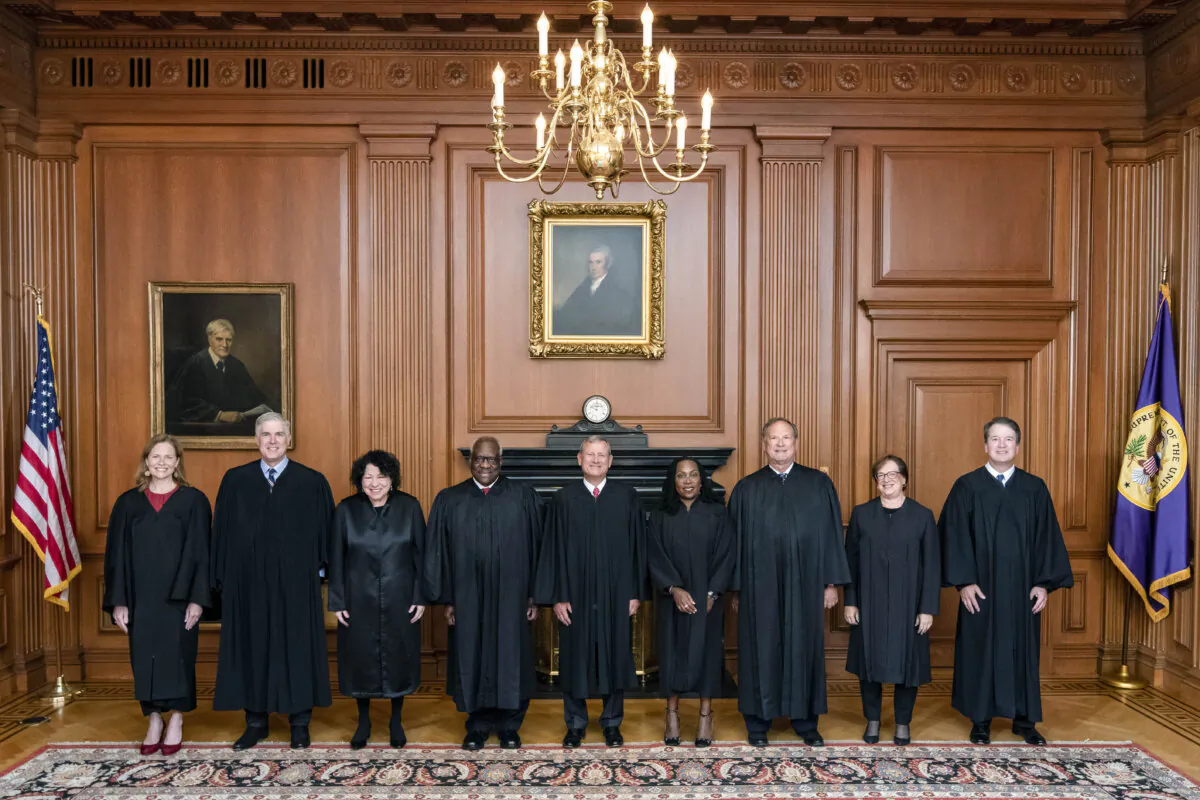 (L–R) Supreme Court Justices Amy Coney Barrett, Neil M. Gorsuch, Sonia Sotomayor, and Clarence Thomas, Chief Justice John G. Roberts, Jr., and Justices Ketanji Brown Jackson, Samuel A. Alito, Jr., Elena Kagan, and Brett M. Kavanaugh in Washington on Sept. 30, 2022. (Collection of the Supreme Court of the United States via Getty Images)
