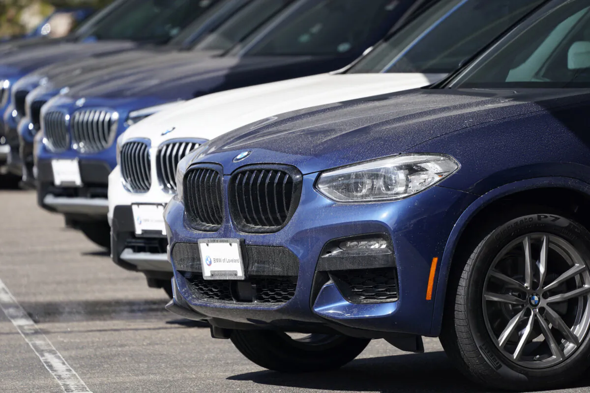 A long row of unsold 2021 X3 sports-utility vehicles sits at a BMW dealership in Loveland, Colo., on March 28, 2021. (David Zalubowski/AP Photo)