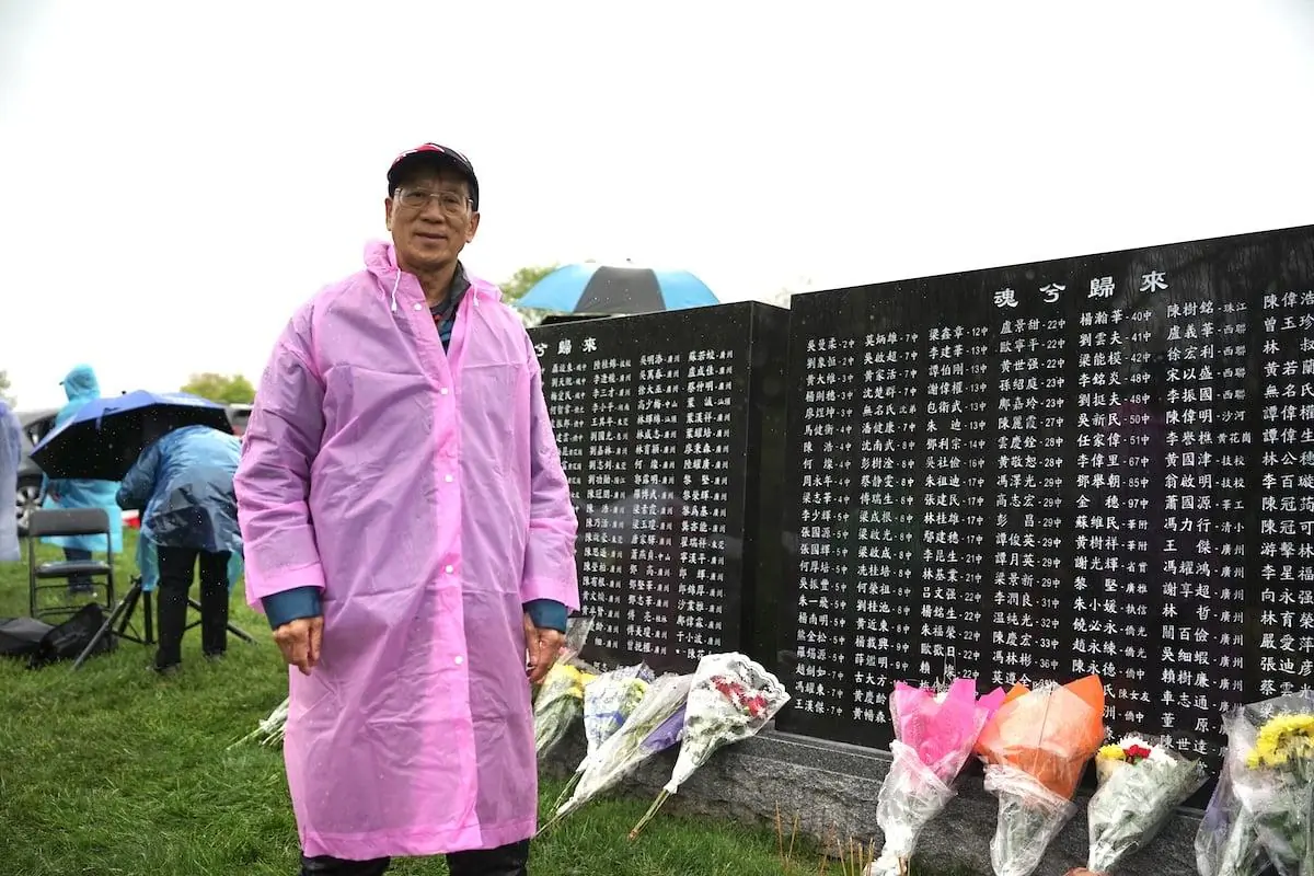 Lou Peng stands in front of a monument commemorating those who died fleeing China to Hong Kong during the Cultural Revolution, in May 2023, in New Jersey, the United States (Jenny Zeng /The Epoch Times)
