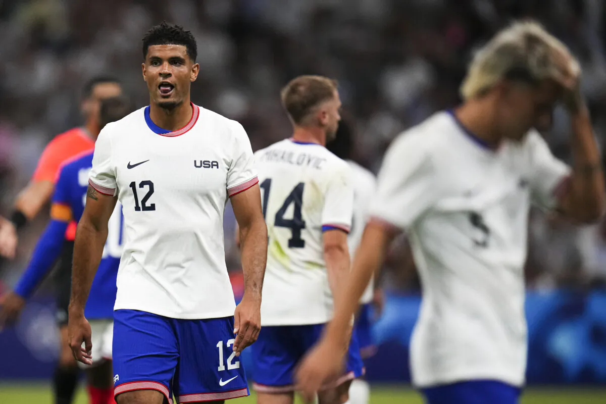 The United States' Miles Robinson (12) reacts during the men's Group A soccer match between France and the United States at the Velodrome stadium, during the 2024 Summer Olympics in Marseille, France, on July 24, 2024. (Daniel Cole/AP Photo)