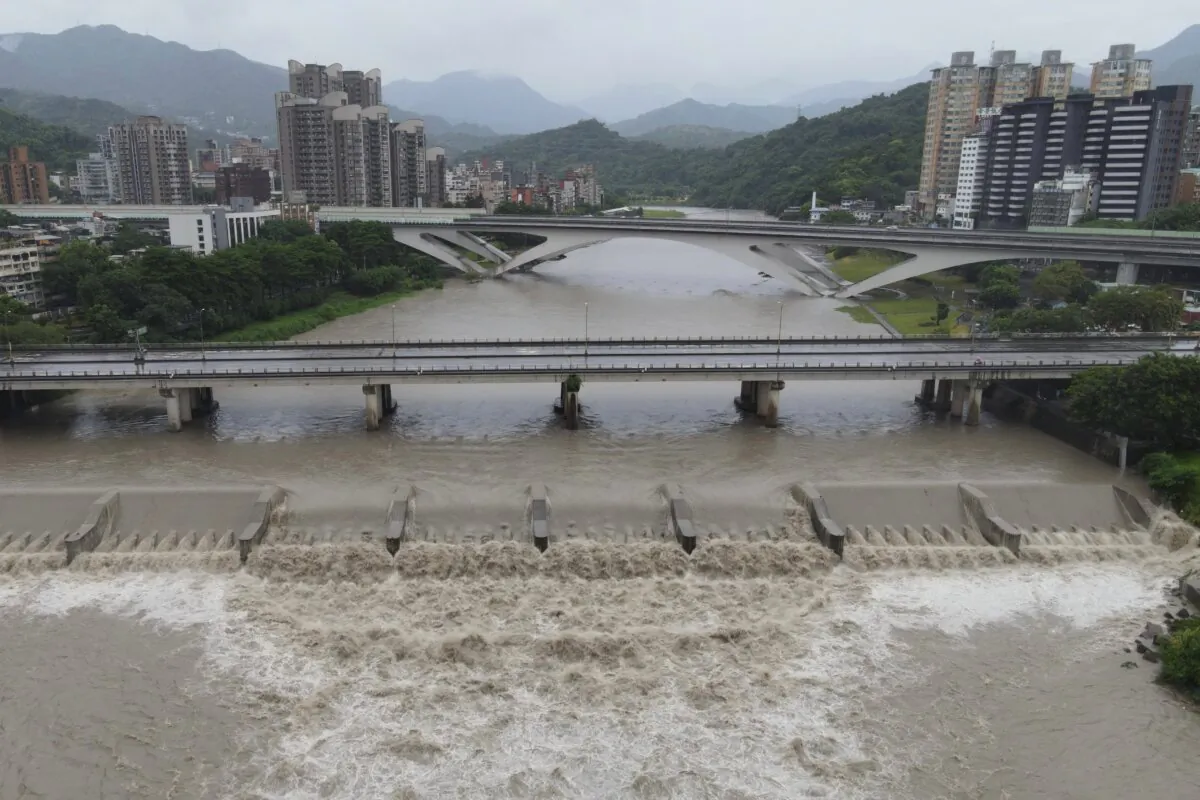 An aerial view shows Xindian river's rising water level at New Taipei City as typhoon Gaemi passes Taiwan on July 25, 2024. (SAM YEH/AFP via Getty Images)