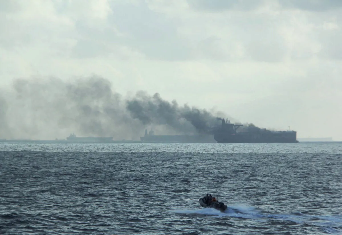 The RSS Supreme's rigid-hulled inflatable boat in the vicinity of the burning vessels following a fire on two oil tankers about 55 kilometeres (34 miles) northeast of the Singaporean island of Pedra Branca, on July 19, 2024. (Republic of Singapore Navy/Handout via Reuters)