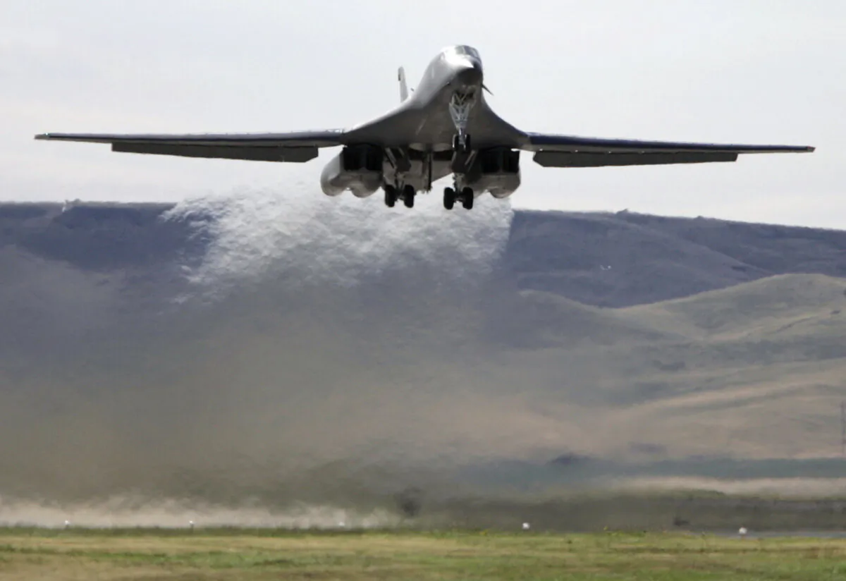 In this Aug. 25, 2005 file photo, a B-1 bomber takes off from Ellsworth Air Force Base in South Dakota.  A fiery January crash of a B-1 bomber aircraft in South Dakota was caused by multiple crew failures, winter weather and a last-minute brush with wind shear that resulted in all four members ejecting and the total loss of the $450 million warplane. That was the finding of an investigation announced Thursday by Air Force Global Strike Command.   (AP Photo/Nati Harnik)