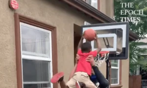 Police Officer Lifts Little Kids to Help Them Dunk Basketballs