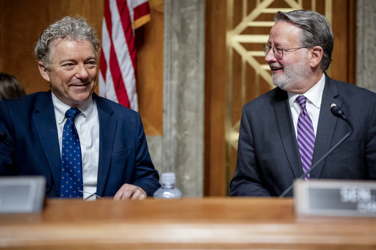 Homeland Security and Governmental Affairs Committee Chairman Gary Peters (D-Mich) and Ranking Member Sen. Rand Paul (R-Ky.) arrive before U.S. Homeland Security Secretary Alejandro Mayorkas testifies on Capitol Hill in Washington on April 18, 2024. (Andrew Harnik/Getty Images)