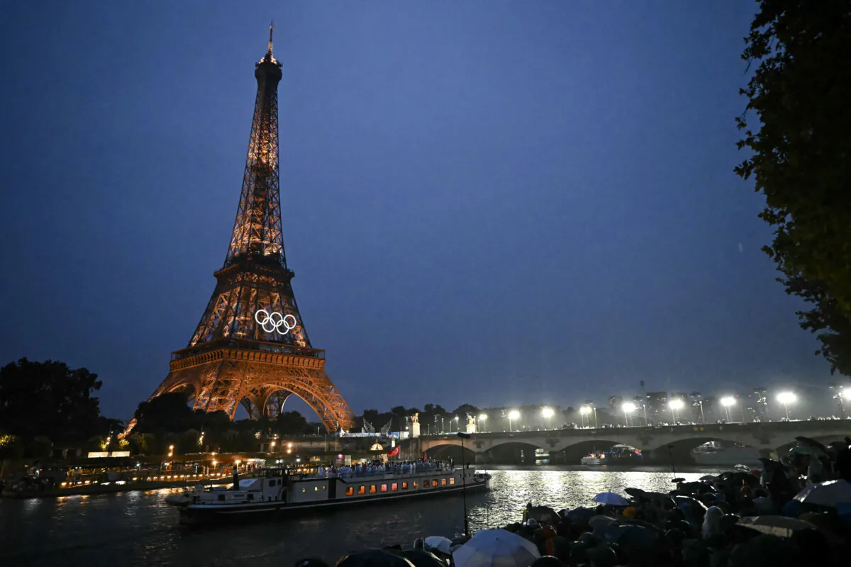 The delegations from Tunisia and Turkey sail in a boat along the river Seine during the opening ceremony of the Paris 2024 Olympic Games in Paris on July 26, 2024. (Paul Ellis/AFP via Getty Images)