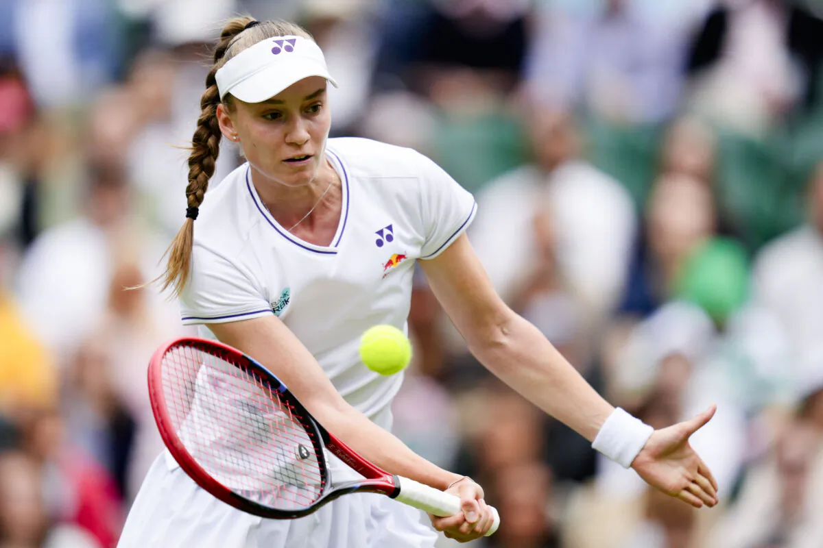 Elena Rybakina of Kazakhstan plays a forehand return to Elina Svitolina of Ukraine during their quarterfinal match at the Wimbledon tennis championships in London on July 10, 2024. (Kirsty Wigglesworth/AP Photo)