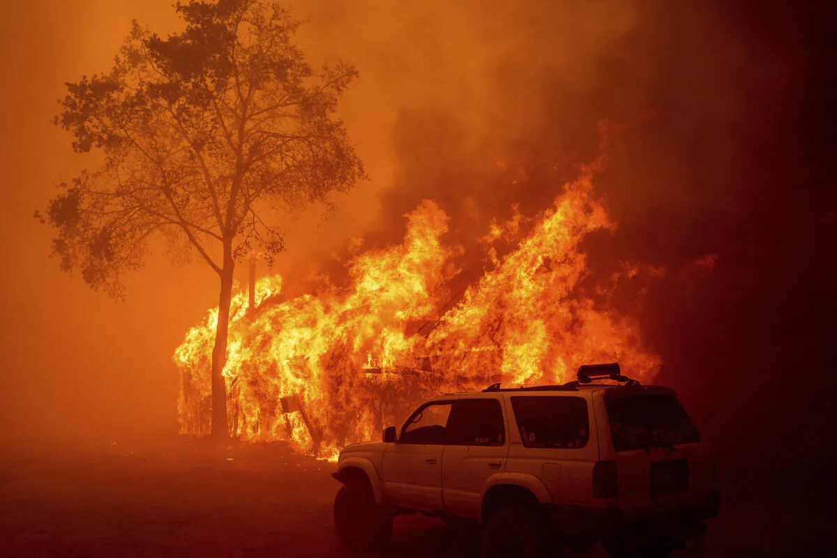 Flames consume a building as the Park Fire tears through the Cohasset community in Butte County, Calif., July 25, 2024. (Noah Berger/AP Photo)