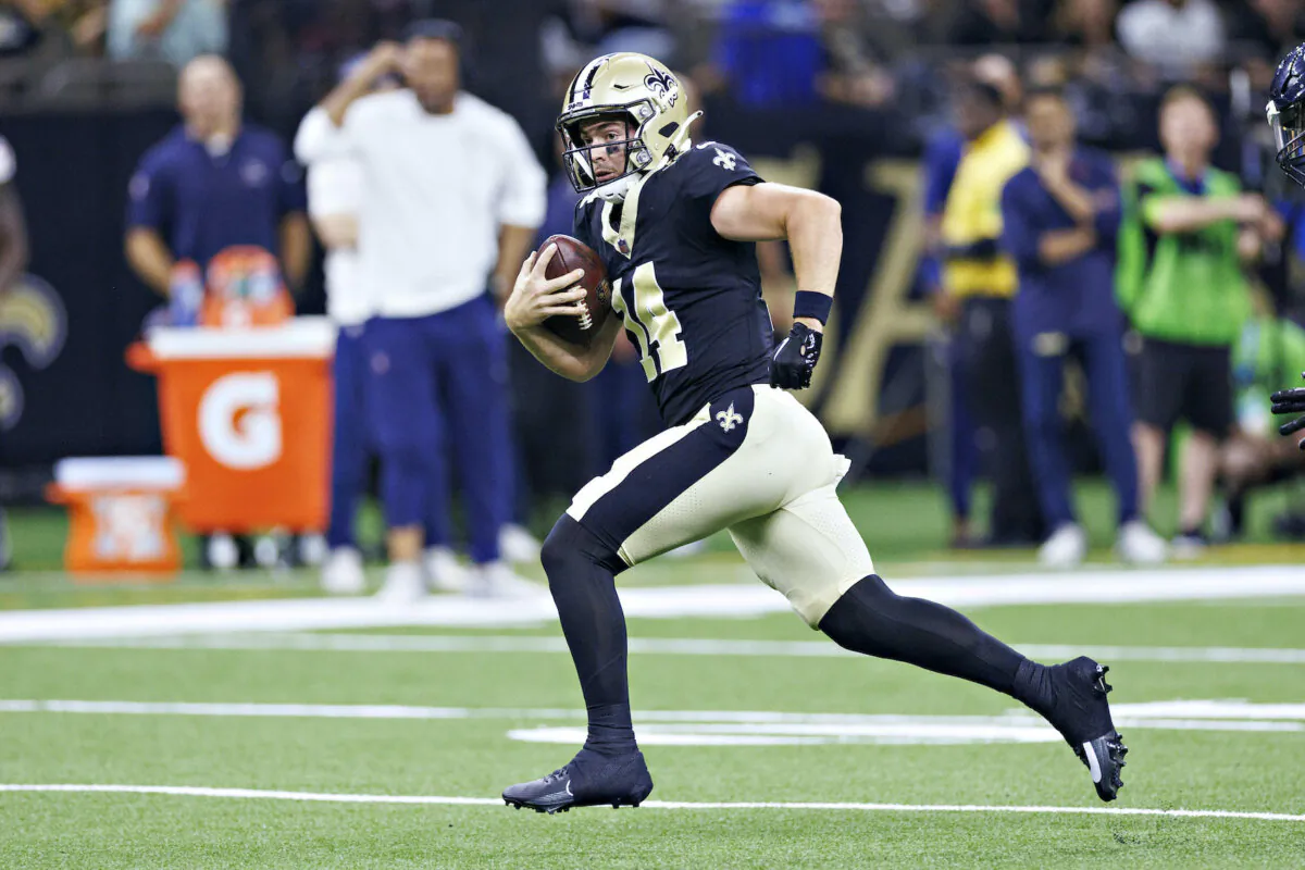 Jake Haener #14 of the New Orleans Saints runs the ball during the preseason game against the Houston Texans at Caesars Superdome in New Orleans, La., on Aug. 27, 2023. (Wesley Hitt/Getty Images)