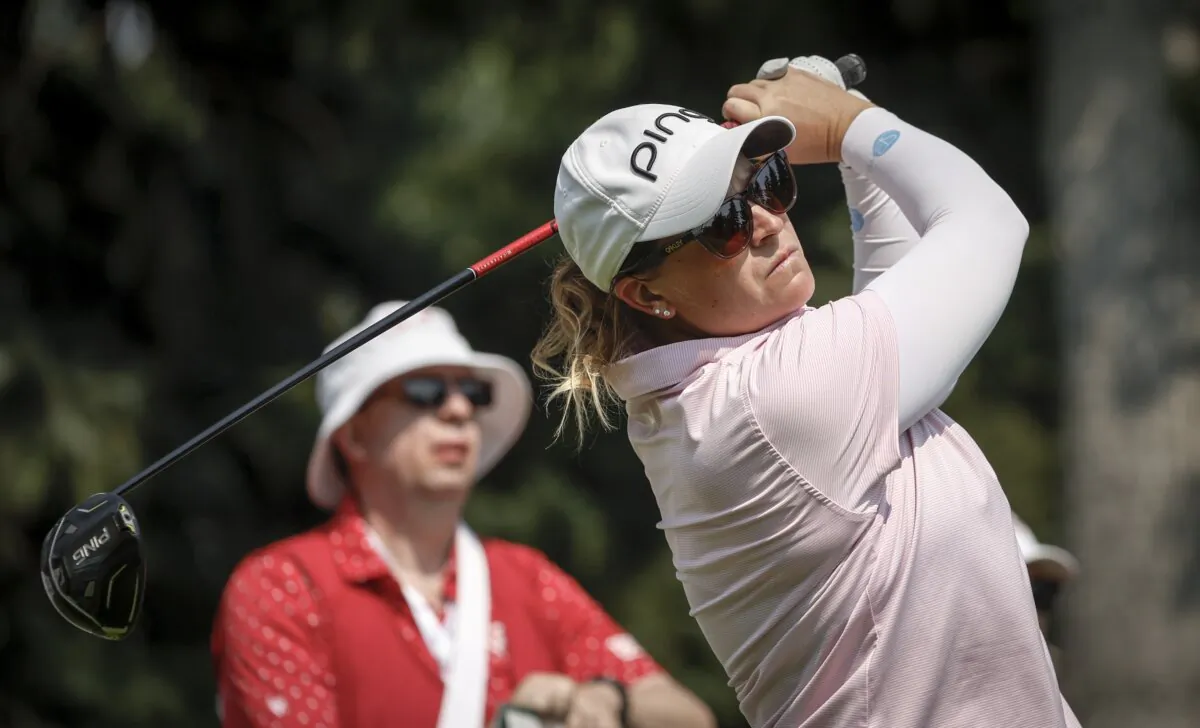 Lauren Coughlin, of the United States, hits a tee shot on the seventh hole during the second round at the LPGA Canadian Women's Open golf tournament in Calgary, Alberta on July 26, 2024. (Jeff McIntosh/The Canadian Press via AP)