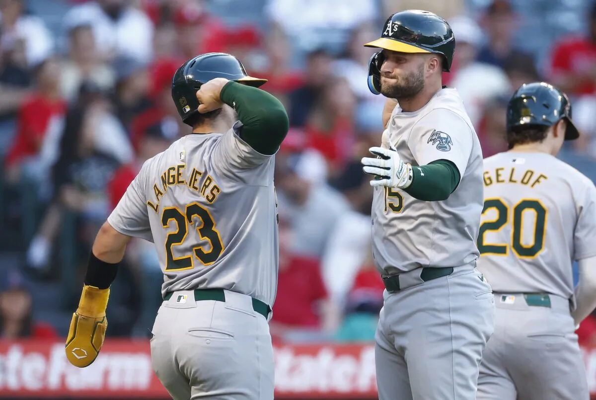 Seth Brown (15) of the Oakland Athletics celebrates a two-run home run with Shea Langeliers (23) against the Los Angeles Angels in the second inning in Anaheim, Calif., on July 26, 2024. (Ronald Martinez/Getty Images)