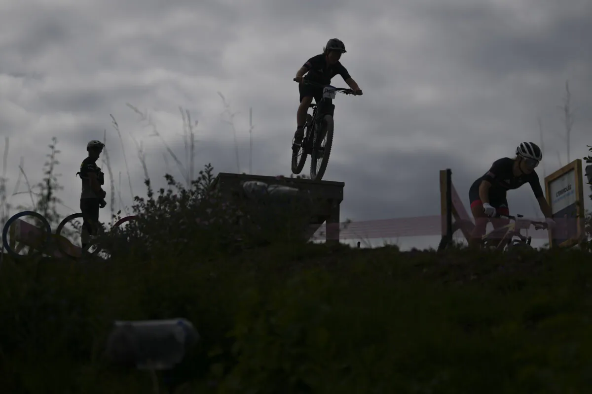 British team members practice at the Mountain Bike cycling track at the 2024 Summer Olympics in Elancourt, France, on July 25, 2024. (Ricardo Mazalan/AP Photo)