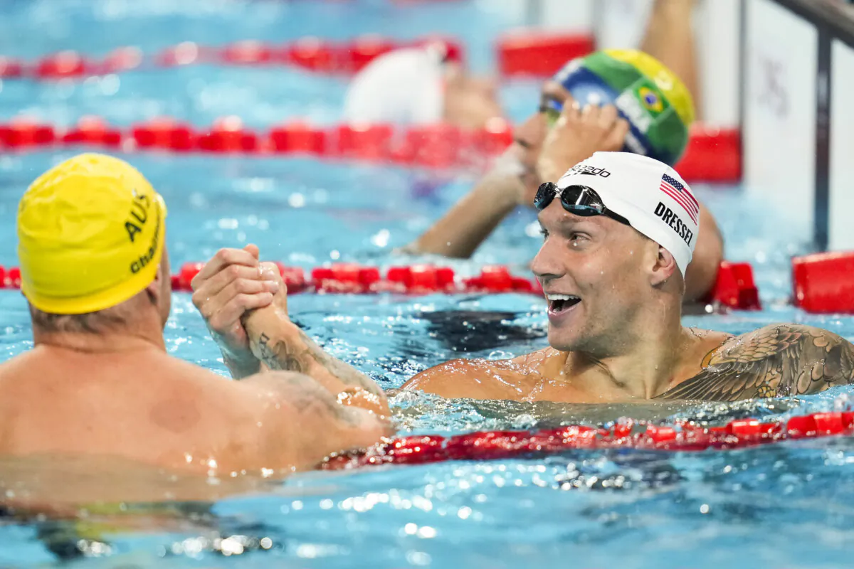 Caeleb Dressel of the United States (R) and Kyle Chalmers of Australia shake hands after a heat in the men's 4x100-meter freestyle relay at the 2024 Summer Olympics in Nanterre, France, on July 27, 2024. (Ashley Landis/AP Photo)