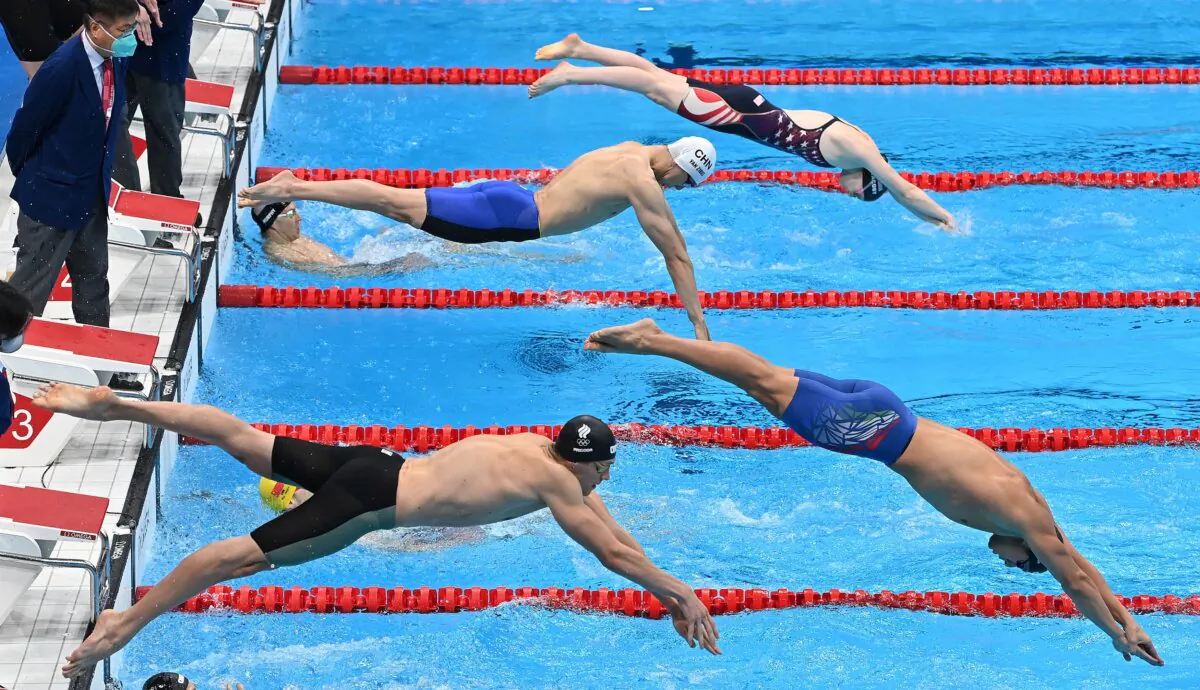 From top, USA's Lydia Jacoby, China's Yan Zibei, Italy's Nicolo Martinenghi, and Russia's Kirill Prigoda dive to compete in their leg of the final of the mixed 4x100m medley relay swimming event during the Tokyo 2020 Olympic Games at the Tokyo Aquatics Centre in Tokyo on July 31, 2021. (Photo by Attila KISBENEDEK / AFP) (Photo by ATTILA KISBENEDEK/AFP via Getty Images)