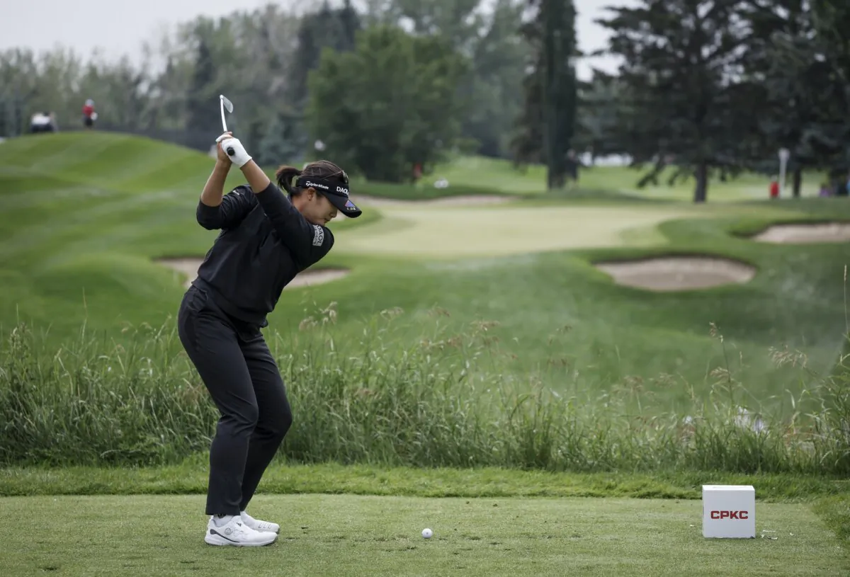 South Korea's Haeran Ryu hits a tee shot on the third hole during the third round of the LPGA Canadian Women's Open golf tournament in Calgary, Alberta, on July 27, 2024. (Jeff McIntosh/The Canadian Press via AP)